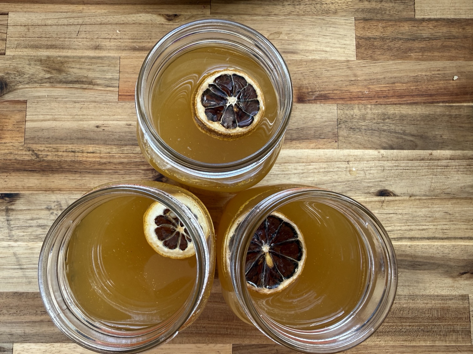 Three jars of Hocho Sunstone with dried citrus
